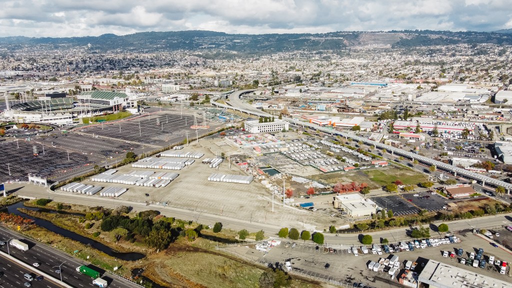 The image displays an aerial view of the Malibu Lot.