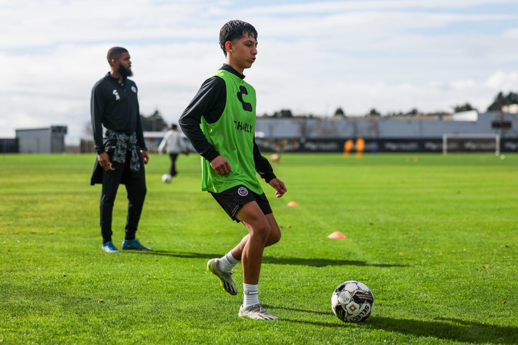 Image of Oakland Roots SC academy contract player, Javier Bedolla Vera, training while being coached by Joseph Nane. 