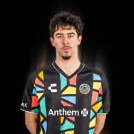 Tomas Caminos is wearing an Oakland Roots SC Primary kit jersey.