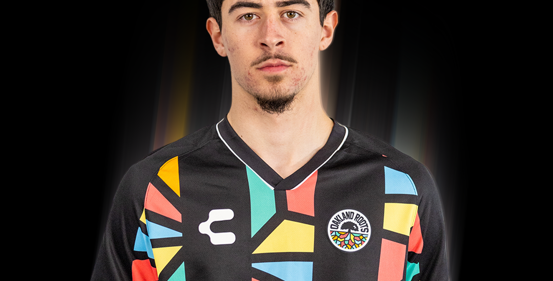 Tomas Caminos is wearing an Oakland Roots SC Primary kit jersey.